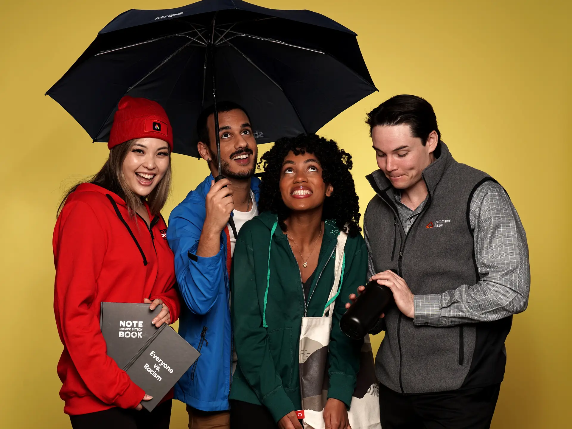 Colleagues enjoying branded products under umbrella