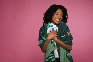 Woman hugging plush toy in branded merchandise photo