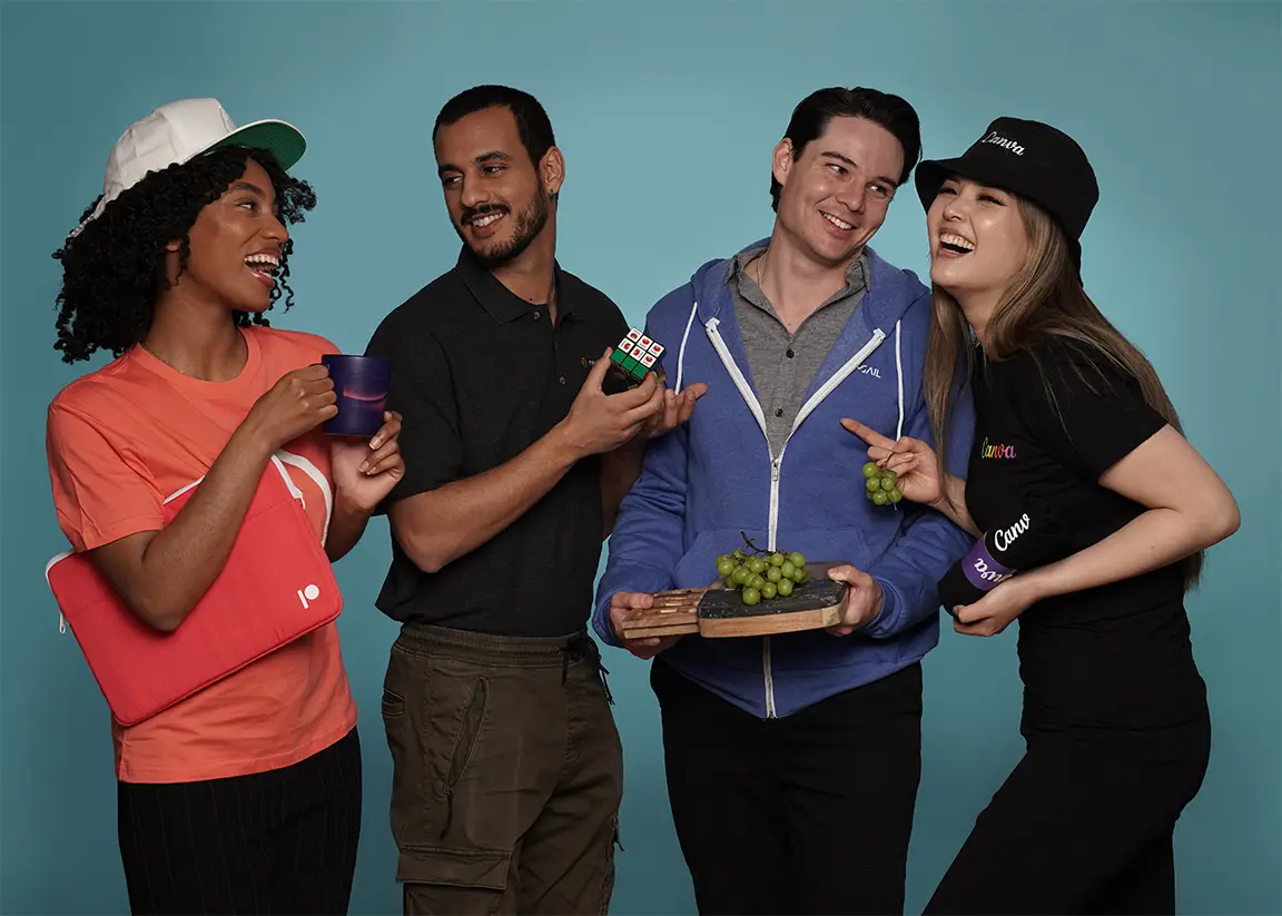 Colleagues sharing grapes and promotional products