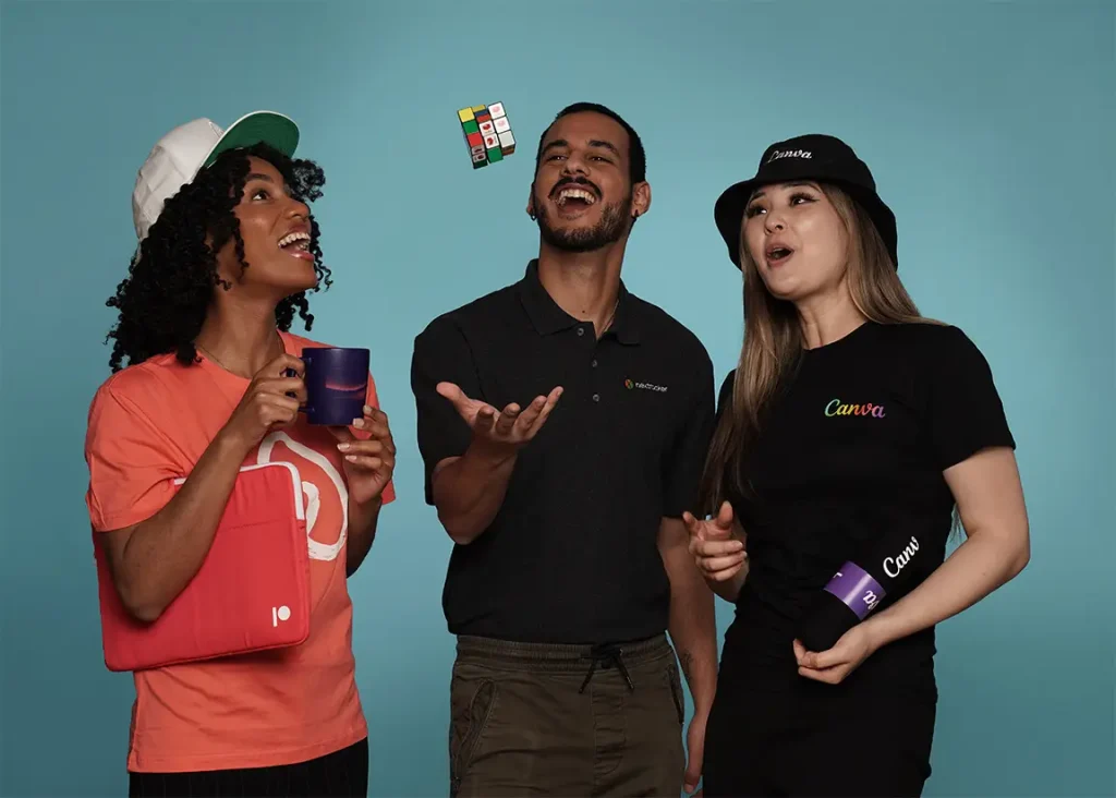 Team juggling Rubik's cube with branded mugs