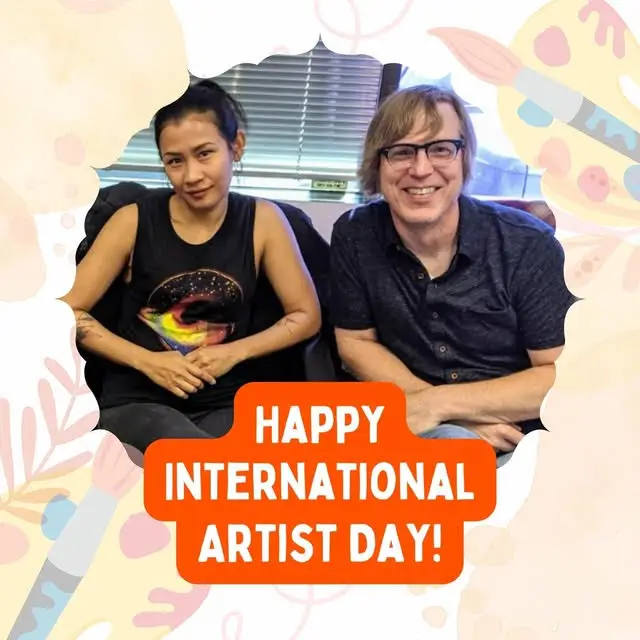 Two smiling people celebrating International Artist Day, representing Social Imprints’ commitment to creative collaboration and quality custom branded merchandise for corporate swag and promotional products.