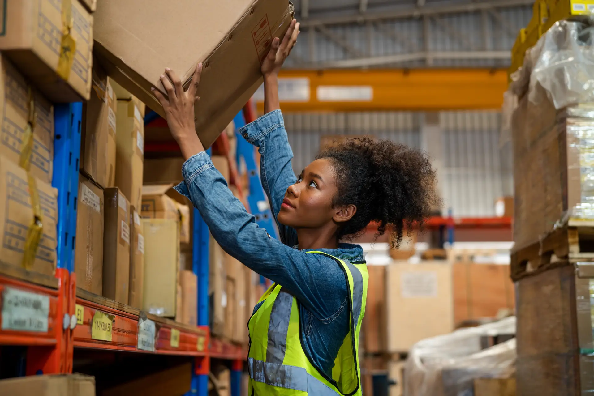 Woman organizing products in warehouse