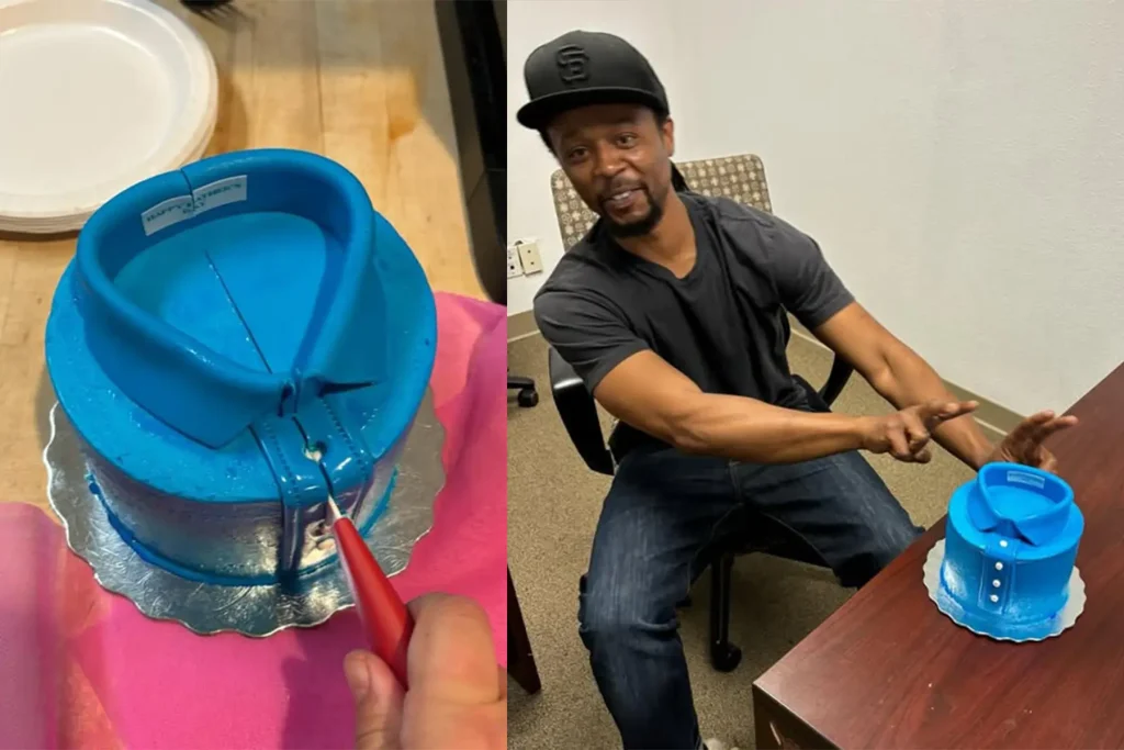 Man sitting at office desk with custom blue shirt-shaped cake, showcasing unique corporate gifting and employee recognition ideas from a top swag company.