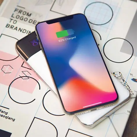 Custom branded wireless phone chargers and tech swag items for corporate events and employee gifts, showcasing promotional products for business branding and giveaways.