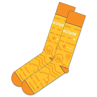 Bright orange custom Grafana socks featuring branded design, perfect for new hire swag kits and tech conference giveaways