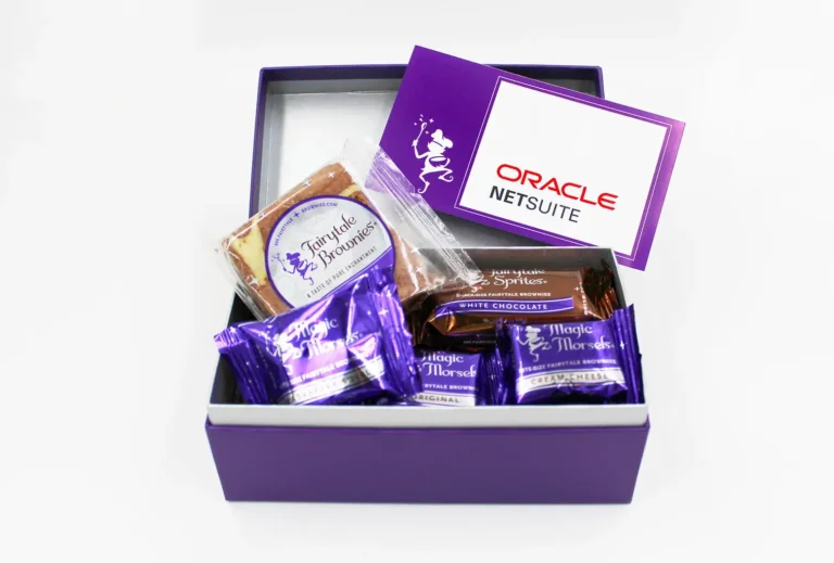 Purple branded corporate gift box with custom Oracle NetSuite card and assorted individually wrapped Fairytale Brownies, ideal for employee recognition and corporate gifting.