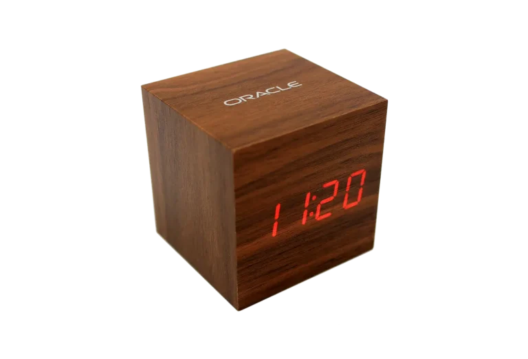 Wooden digital alarm clock with custom Oracle logo, ideal promotional product for corporate gifts, employee swag, and branded giveaway items for events.