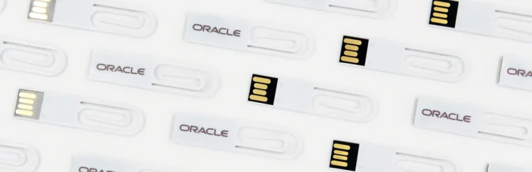 Custom branded USB flash drives with Oracle logo, ideal promotional products for corporate swag, giveaways for events, and personalized business gifts.