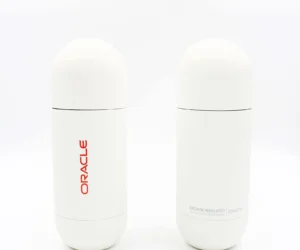 White vacuum insulated promotional water bottles with custom red Oracle logo and sleek minimalist design, ideal corporate swag for events and employee gifts.