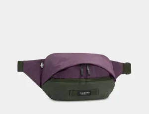 Custom branded purple and green Timbuk2 waist bag, ideal promotional swag item for corporate events, giveaways, and employee gifts.