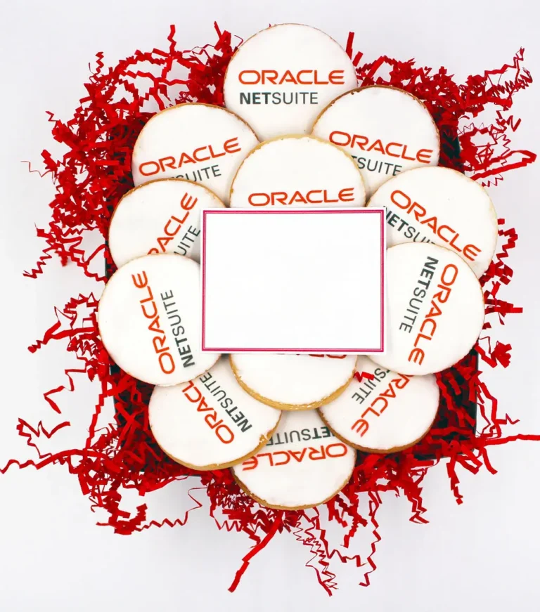 Custom branded Oracle NetSuite logo cookies arranged in a gift box with red shredded paper, perfect for corporate gifts, event giveaways, and promotional products.