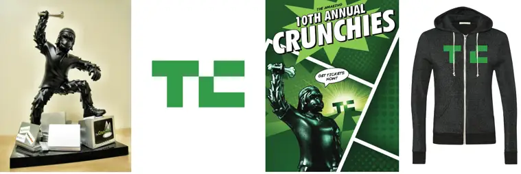 Custom branded TechCrunch Crunchies award statue and black zip-up hoodie with green "TC" logo, showcasing premium corporate swag and promotional products for events.