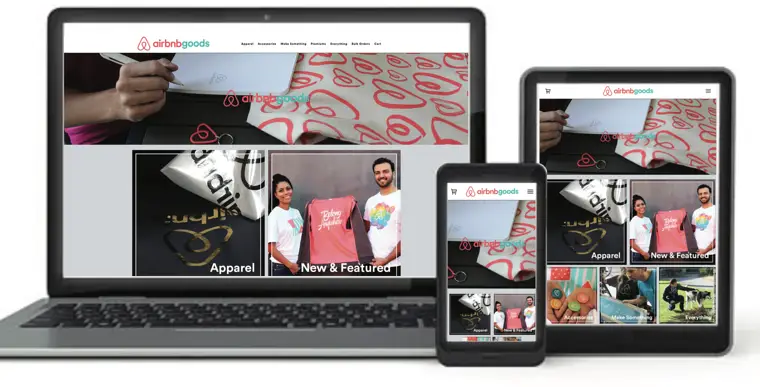Responsive e-commerce corporate swag store displayed on laptop, tablet, and smartphone featuring custom branded apparel and promotional products for employee gifting and event giveaways.